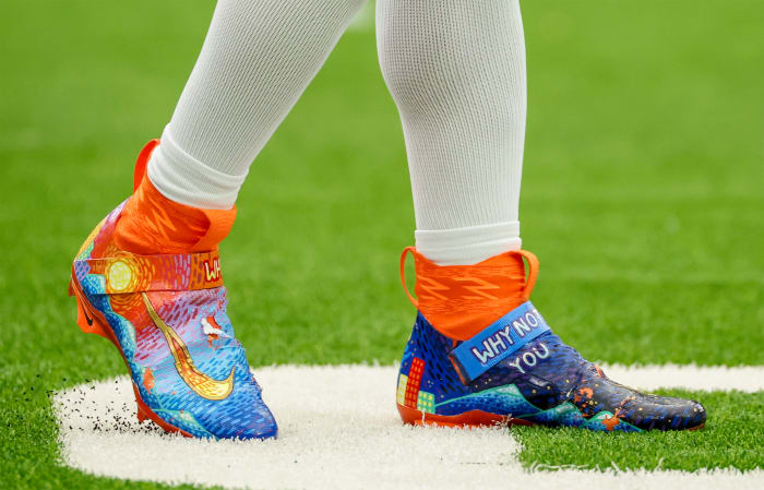Denver Broncos quarterback Russell Wilson's blue and orange Nike cleats.